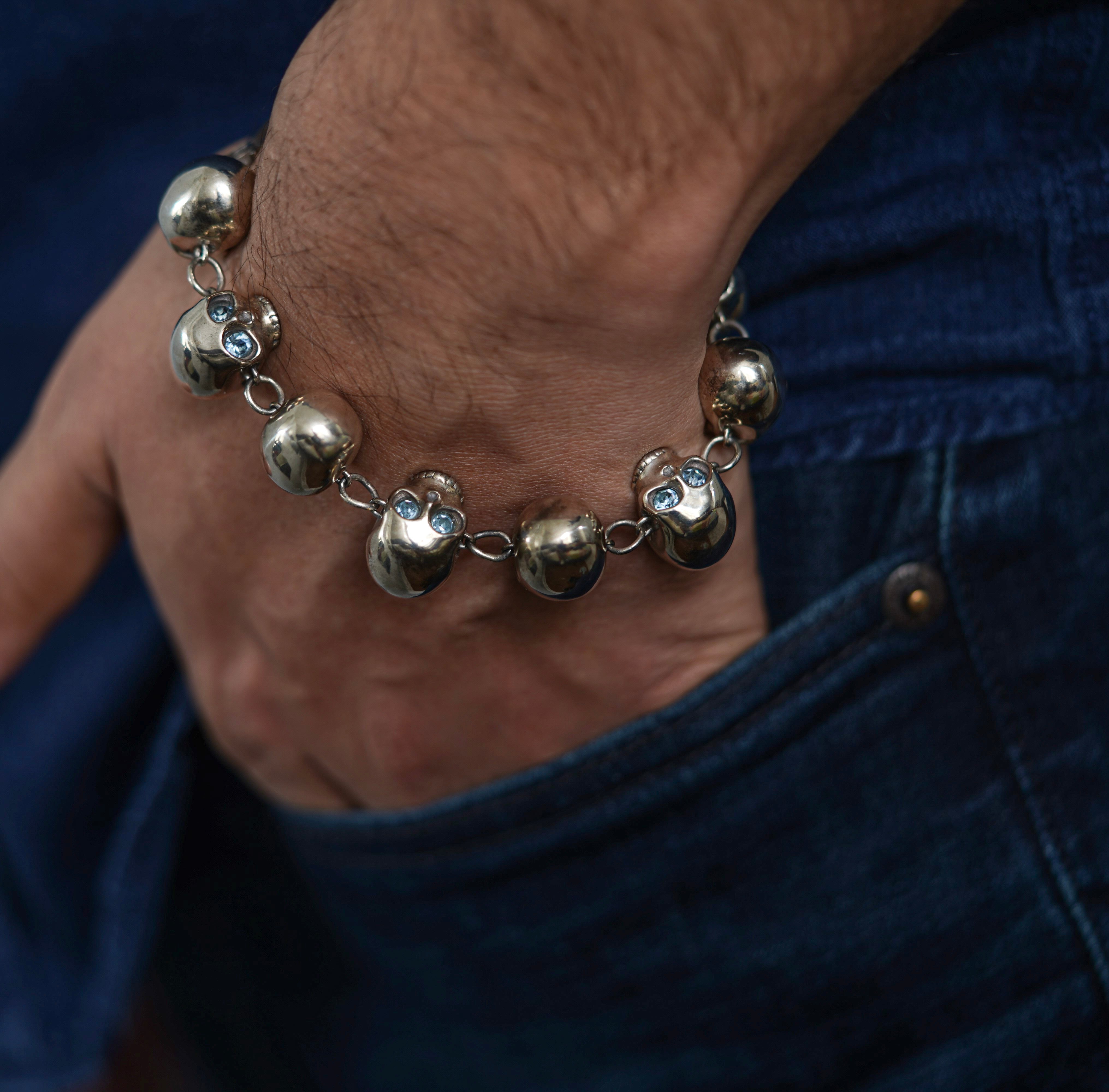 Handmade sterling silver eternity skull bracelet with round cut glass eyes