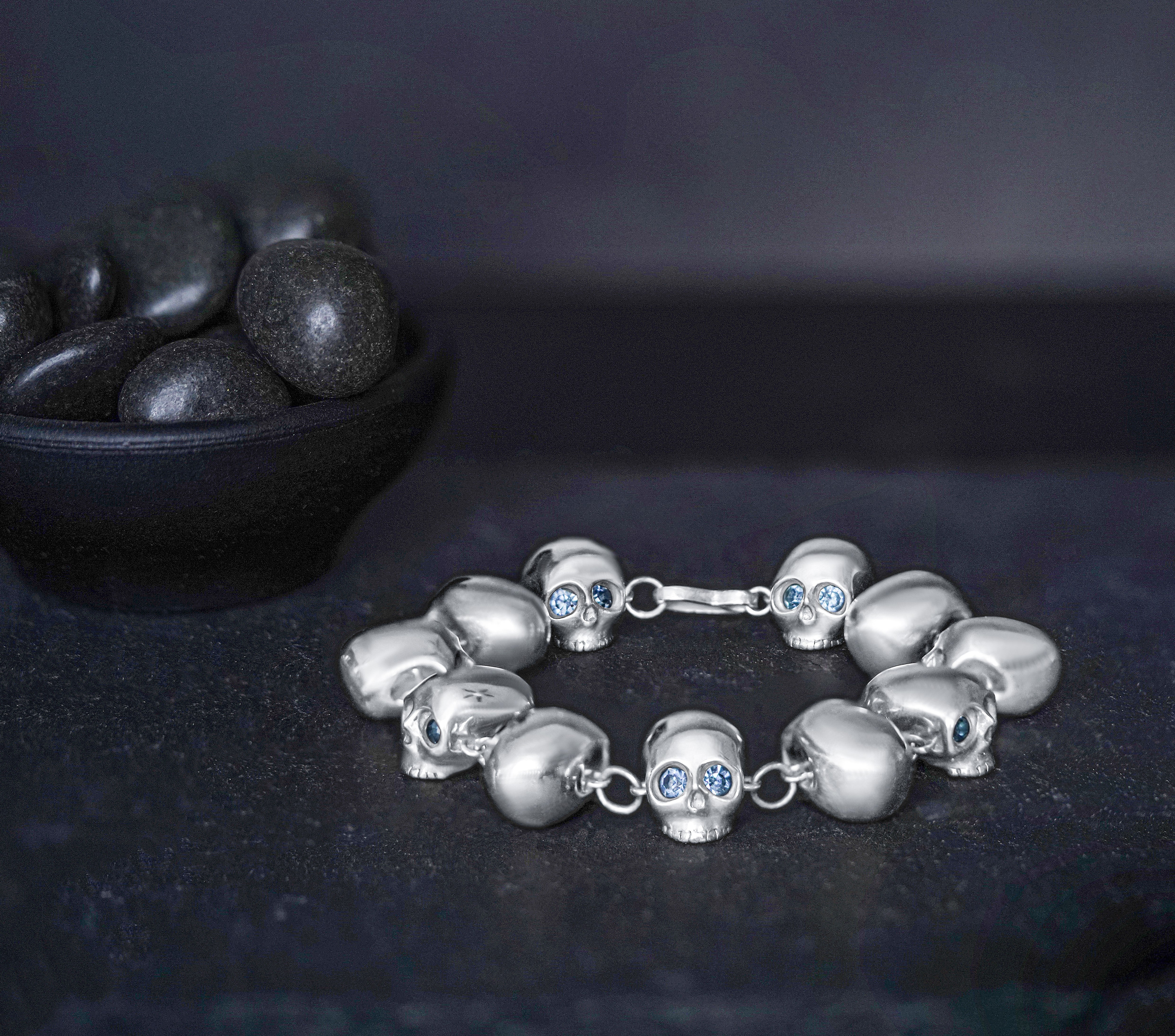 Handmade sterling silver eternity skull bracelet with round cut glass eyes